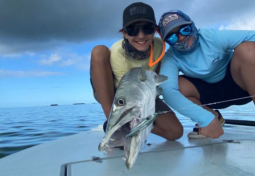 Fishermen on a Florida Keys barracuda fishing charter